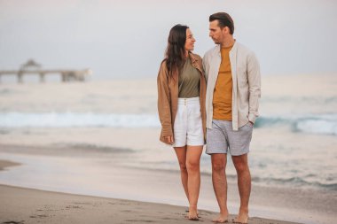 Romantic couple in love on the beach on romantic honeymoon travel