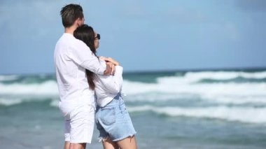 Romantic couple in love walking on the beach on romantic honeymoon travel