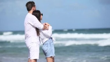 Romantic couple in love walking on the beach on romantic honeymoon travel