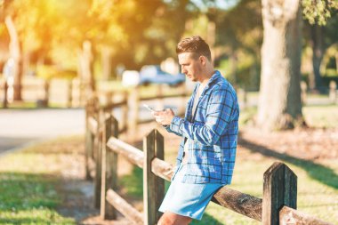 Young man using mobile phone. High quality photo