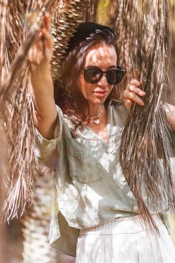 Happy young woman outdoor in the park at sunset. High quality photo