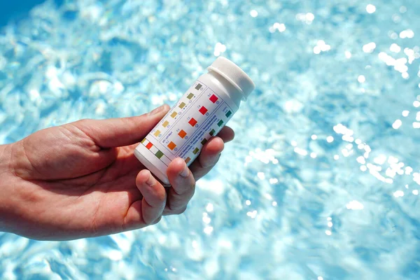 Swimming pool test water on ph and chemical balance. High quality photo
