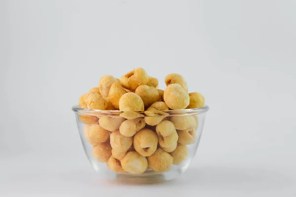 Freeze dried longan in glass bowl on white background. Freeze-drying is a processing that preserves the nutritional value of food.