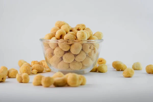 Freeze dried longan in glass bowl on white background. Freeze-drying is a processing that preserves the nutritional value of food.