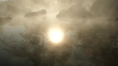 Hot springs and fog in Thailand with morning sunlight. Morning atmosphere at Chae Son National Park, Natural Hot Spring, Lampang Province, Thailand.