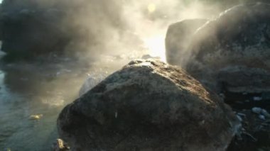 Hot springs and fog in Thailand with morning sunlight. Morning atmosphere at Chae Son National Park, Natural Hot Spring, Lampang Province, Thailand.
