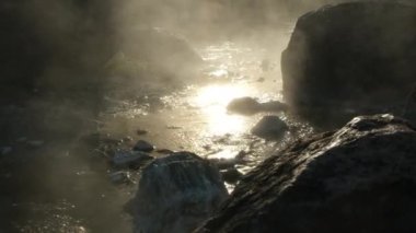 Hot springs and fog in Thailand with morning sunlight. Morning atmosphere at Chae Son National Park, Natural Hot Spring, Lampang Province, Thailand.