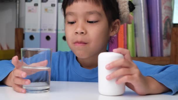 Cute Little Girl Eating Alpha Omega Vitamin Pill Vitamin Supplements — Stok video