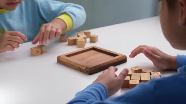Little Siblings Playing Wooden Board Game Tic Tac Toe Table — Video Stock