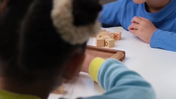 Little Siblings Playing Wooden Board Game Tic Tac Toe Table — Vídeo de stock
