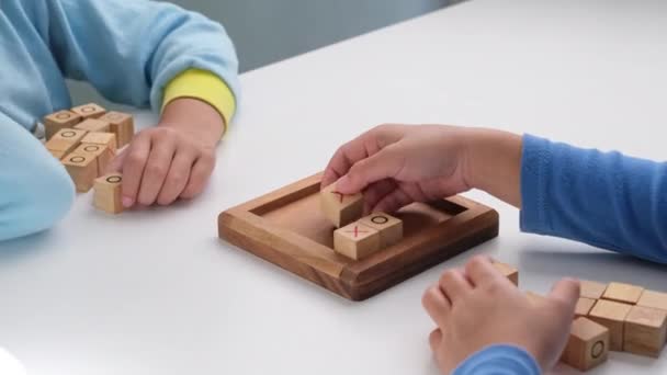 Little Siblings Playing Wooden Board Game Tic Tac Toe Table — Wideo stockowe