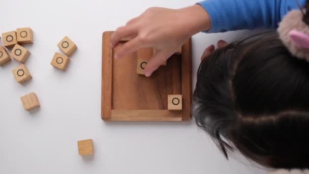 Little Siblings Playing Wooden Board Game Tic Tac Toe Table — 图库视频影像