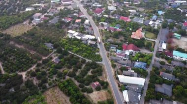 Aerial view of heavy trucks on asphalt road along the way in the countryside. Truck moving on community road, high view. cargo delivery and transportation concept