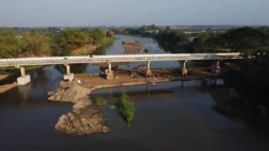 Aerial view of renovation and repair work on the river bridge road.