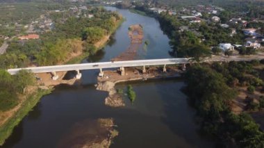 Aerial view of renovation and repair work on the river bridge road.