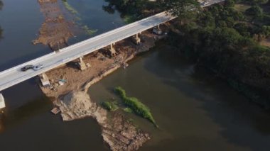 Aerial view of renovation and repair work on the river bridge road.