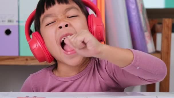 Cheerful Little Girl Headphones Singing Drawing Colored Pencils Paper Sitting — Wideo stockowe