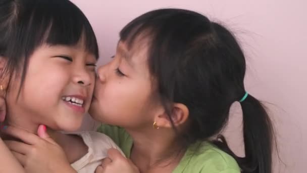 Close Face Happy Cute Little Girl Hugging Twin Sister Kissing — Stock Video © t.scentrio@gmail.com #645734232