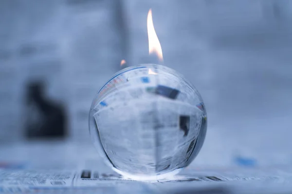 Glass globe on fire. Planet Earth Burning. Global Warming and Climate Change Concept.
