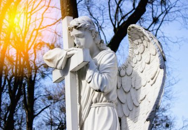 Angel statue close-up in sunbeam