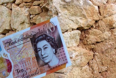 İngiliz poundlarına yakın çekim. Büyük Britanya 'nın ulusal para birimi