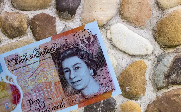 Geçmişe yakın planda İngiliz sterlini. Büyük Britanya ulusal para birimi