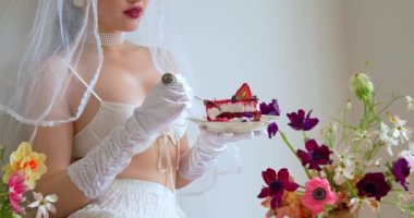 Beauty young Chinese women in an apartment with flowers and a sunny day.