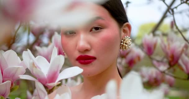 Asian Woman Enjoying Nature Touching Flowers Garden Blooming Magnolia — Stock Video