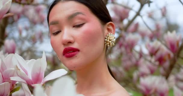 Asian Woman Enjoying Nature Touching Flowers Garden Blooming Magnolia — Stock videók