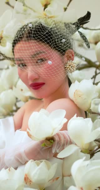 Asian Woman Enjoying Nature Touching Flowers Garden Blooming Magnolia — Vídeo de Stock