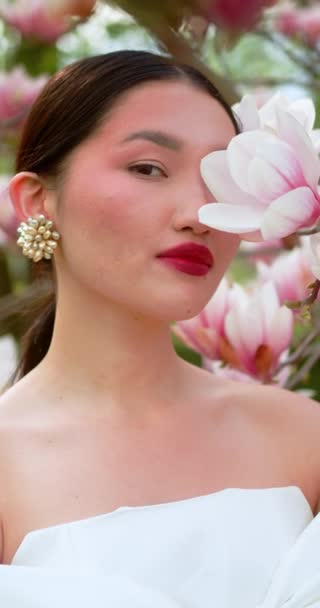 Asian Woman Enjoying Nature Touching Flowers Garden Blooming Magnolia — Stockvideo