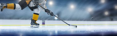 Hockey player in action close-up. Hockey player in ice rink. Hockey concept. Ice. Hockey training. Sport clipart