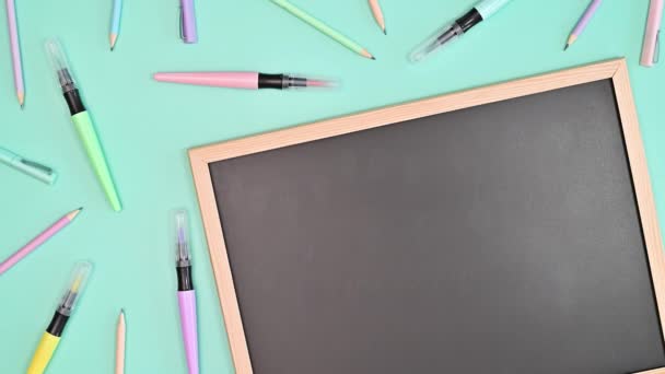 Colorful Pens Blackboard Appear Bright Blue Background Flat Lay Stop — Vídeos de Stock