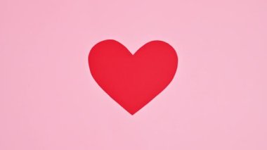 Valentine's day heart changing colors. Stop motion. Flat lay