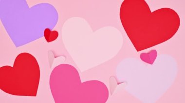 Blinking hearts background. Valentine's day greeting card. Stop motion flat lay