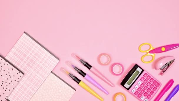 Moving School Stationery Copy Space Pastel Pink Background Stop Motion — Stockvideo