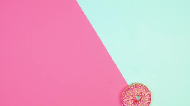 Creative Moving Donuts Strawberry Glaze Two Colored Background Copy Space — Vídeo de stock