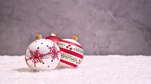Beautiful Arrangement Ornaments Santa Hat Snowy Background Stop Motion — Stock Video