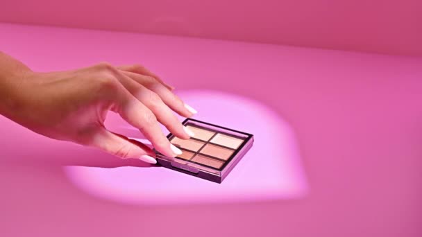Stop Motion Hand Opening Eye Shadow Palette Pastel Pink Background — Stock Video