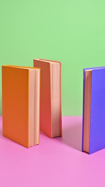 Vertical Stop Motion Dancing Books Pastel Canvas — Stockvideo