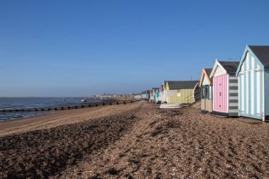 Boats and beach huts on Thorpe Bay beach, Southend-on-Sea, Essex, England, United Kingdom clipart