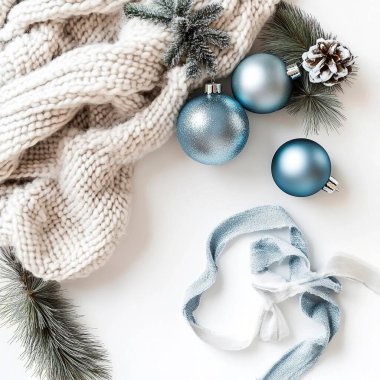 Blue and silver Christmas ornaments with cozy knitted scarf and pine branches. clipart