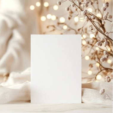 Blank white card with soft lights and dried flowers in the background. clipart