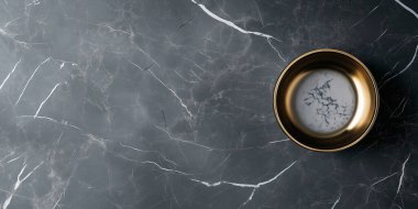 Elegant marble surface with a gold bowl filled with a creamy liquid. clipart