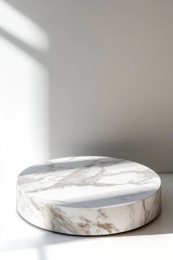 Elegant round marble pedestal with soft natural lighting. clipart