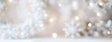 Soft winter wonderland ambiance with blurred snowflakes and festive lights. clipart