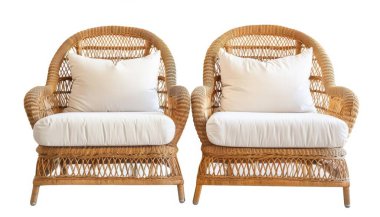 Two elegant rattan chairs with white cushions, perfect for a cozy seating area. clipart