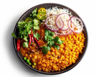 A vibrant bowl of dal with rice, garnished with fresh herbs and spices, showcasing a delicious Indian meal. clipart