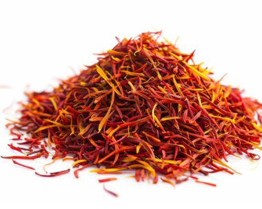 Vibrant saffron strands in a heap, showcasing their rich red and golden hues. clipart