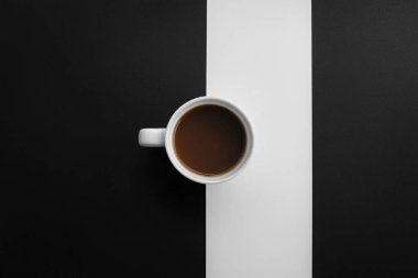 Minimalist Coffe Cup on Black and White Split Surface  Clean and Elegant Design clipart